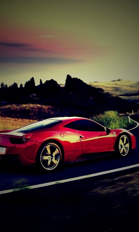 Красная феррари на извилистой дороге обои