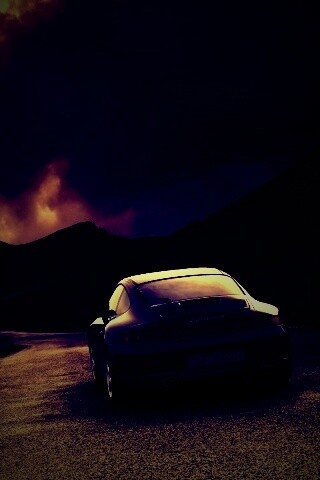 Черный Порше на горной дороге обои