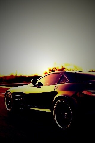 Черный автомобиль уезжает в закат обои