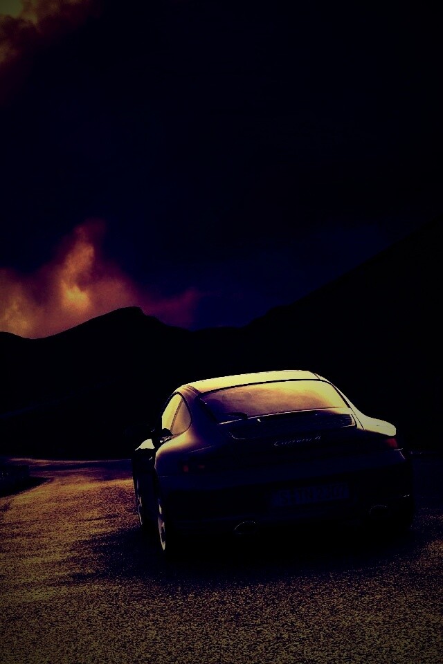 Черный Порше на горной дороге обои