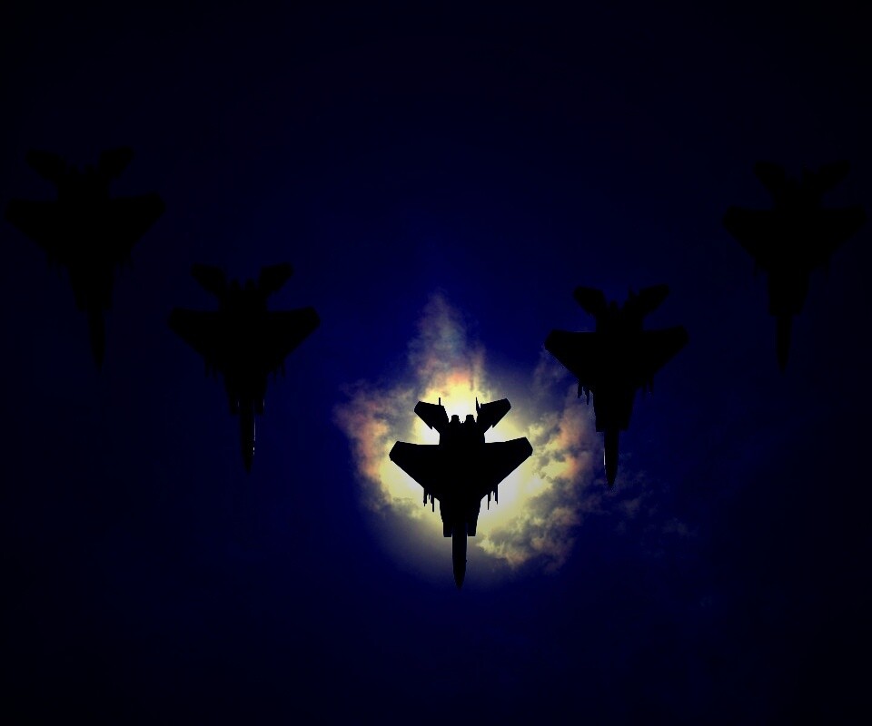 Ряд истрибителей на фоне солнца обои