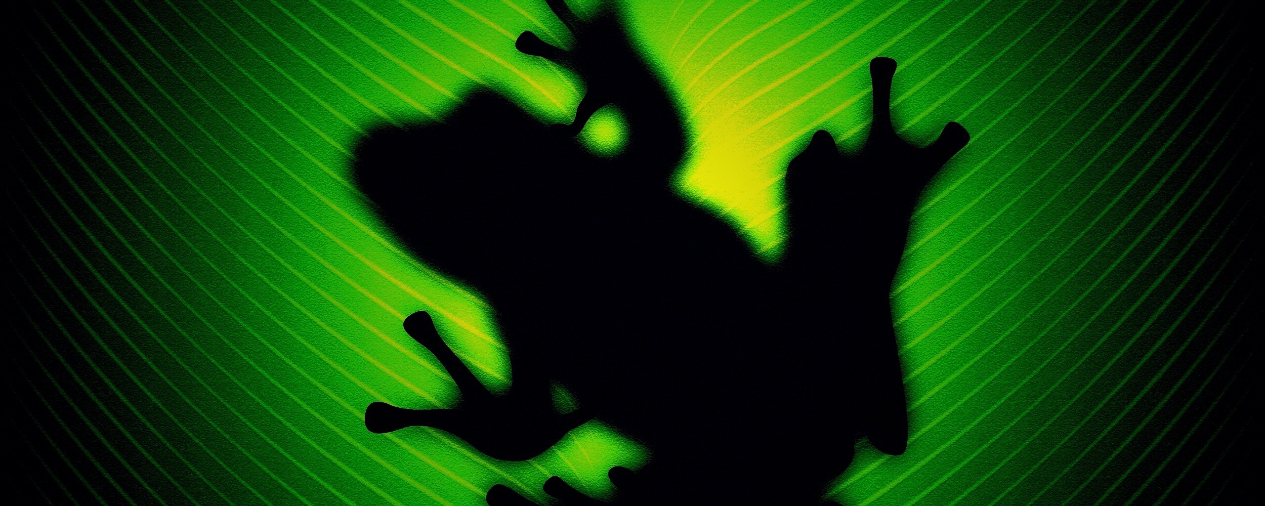 Силуэт лягушки просвечивает сквозь зеленый лист обои