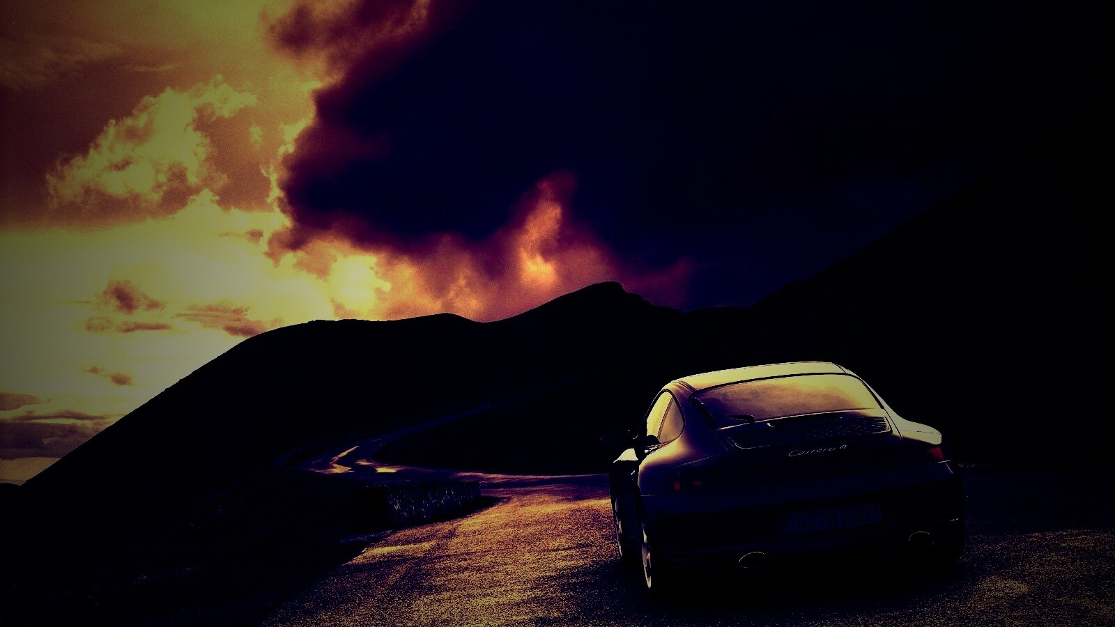 Черный Порше на горной дороге обои