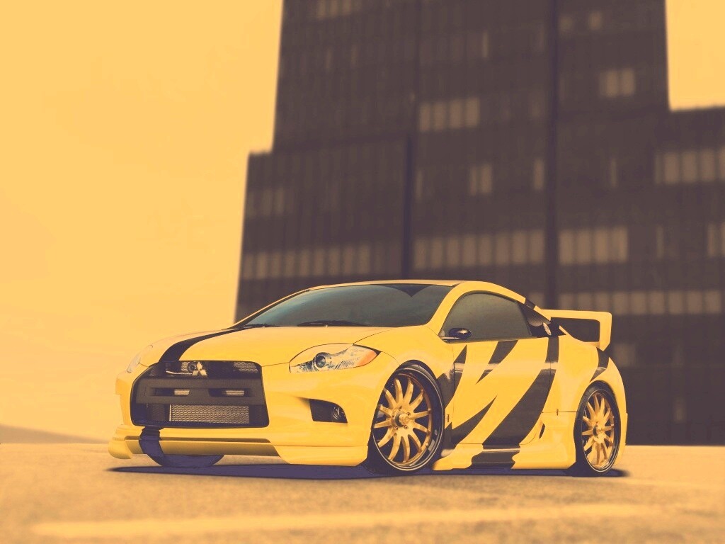 Mitsubishi жёлтого цвета с черными полосами обои