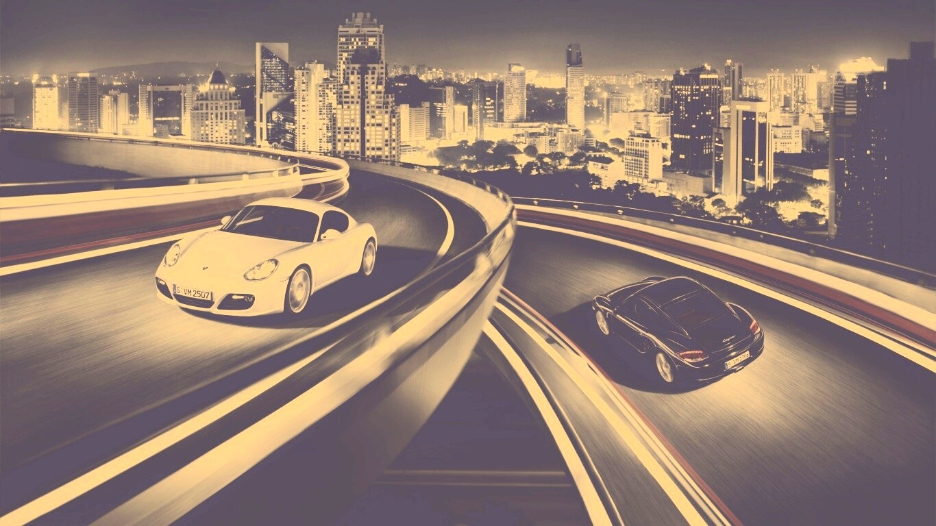 Черный и белый Porsche на автомагистрале. обои