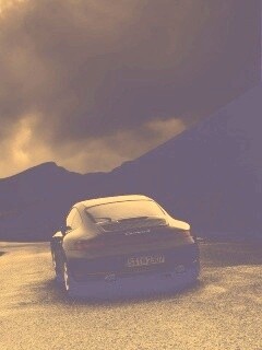 Черный Порше на горной дороге обои