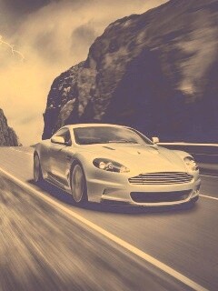 Астон мартин на горной дороге обои