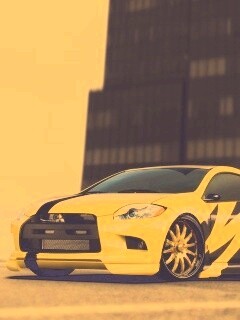 Mitsubishi жёлтого цвета с черными полосами обои