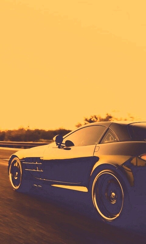 Черный автомобиль уезжает в закат обои