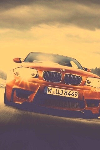 Оранжевый BMW M1 Coupe на треке обои