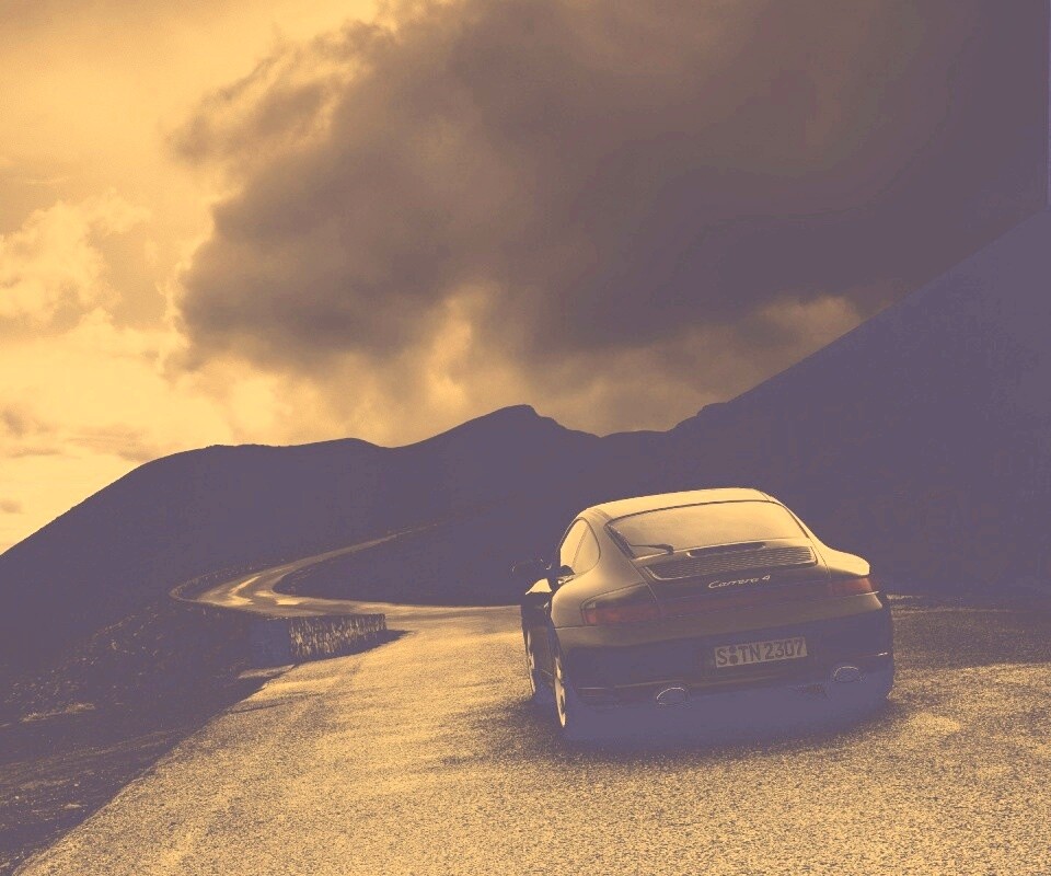 Черный Порше на горной дороге обои