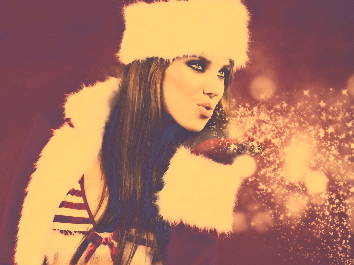 Снегурочка дует на снежинки обои