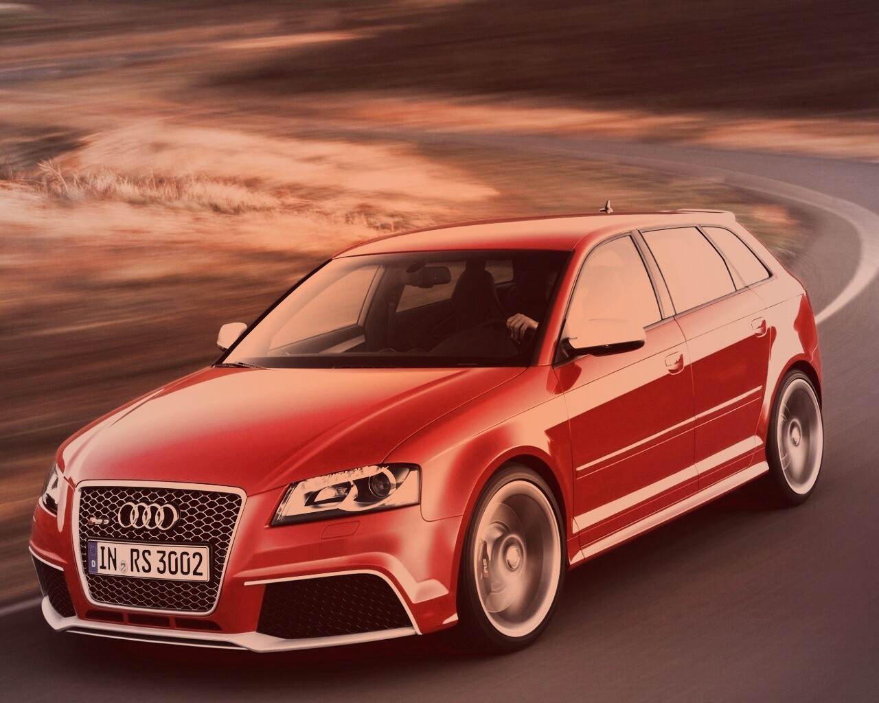 Красная ауди мчится по извилистой дороге обои