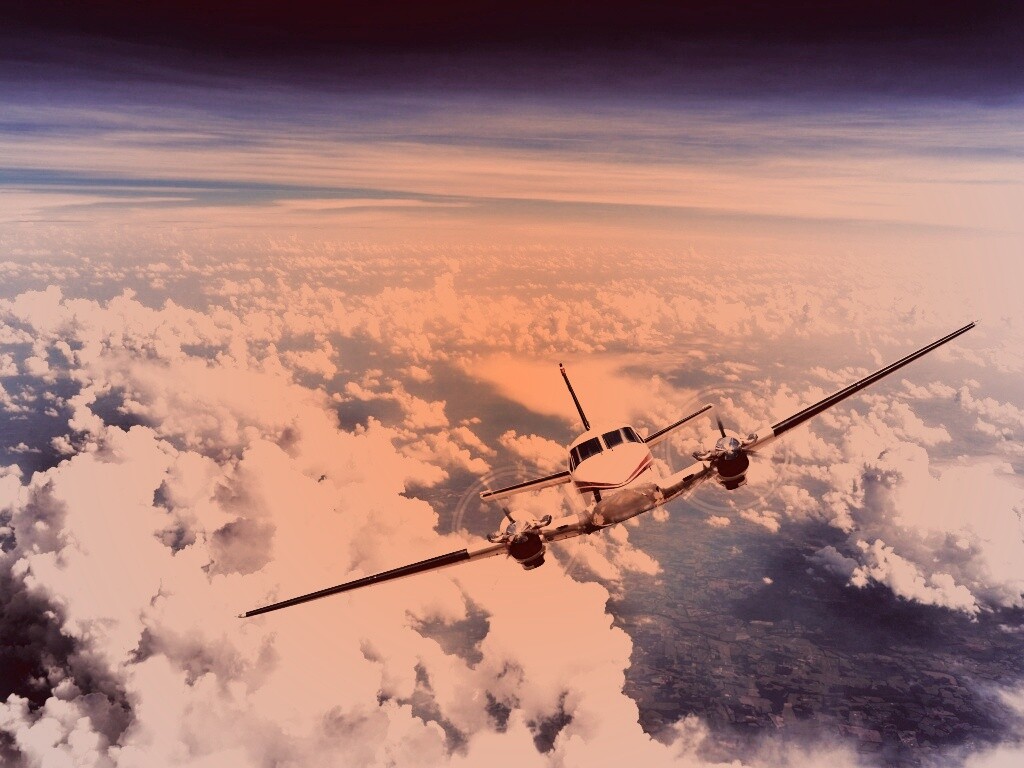Самолет над облаками обои
