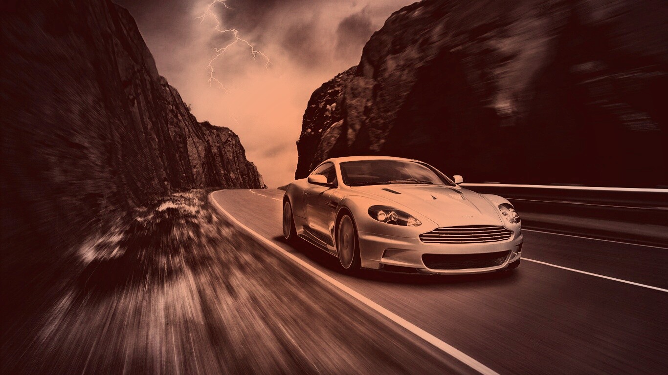 Астон мартин на горной дороге обои