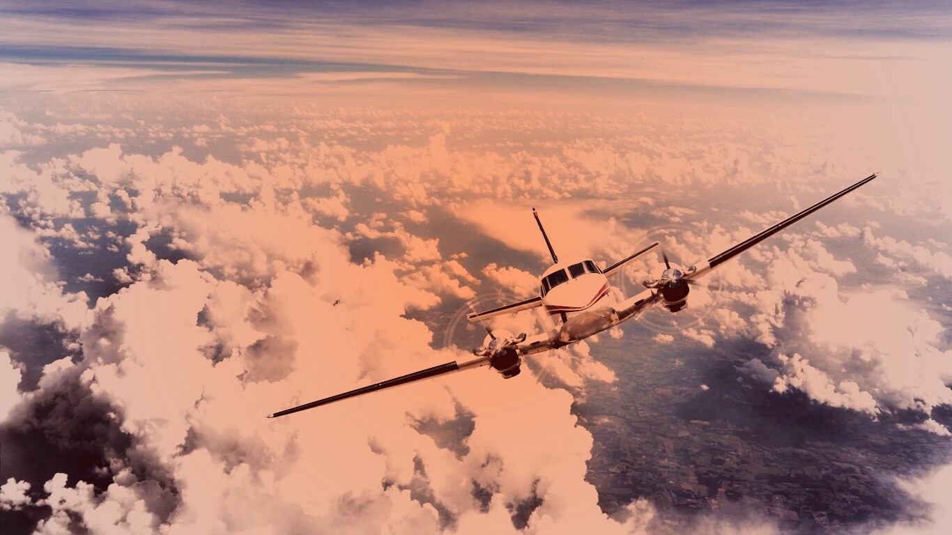 Самолет над облаками обои
