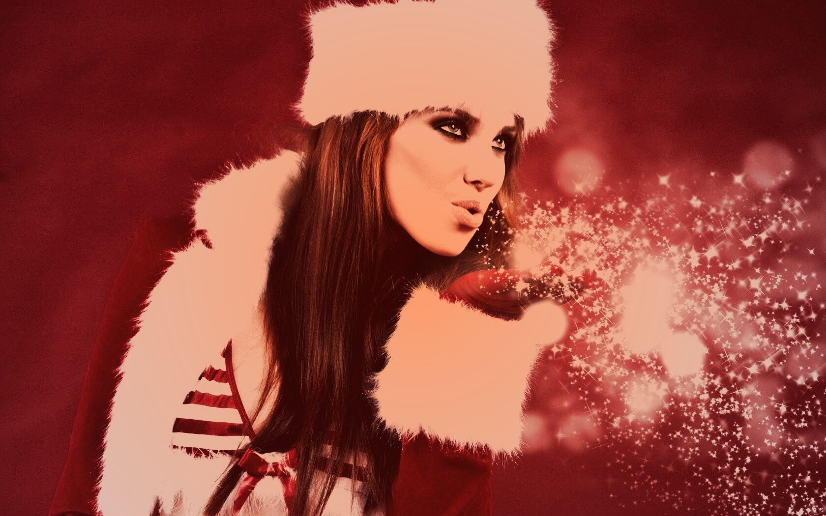 Снегурочка дует на снежинки обои