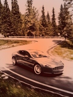Астон мартин на лесной дороге обои