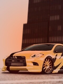 Mitsubishi жёлтого цвета с черными полосами обои