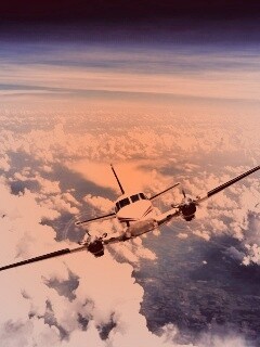 Самолет над облаками обои