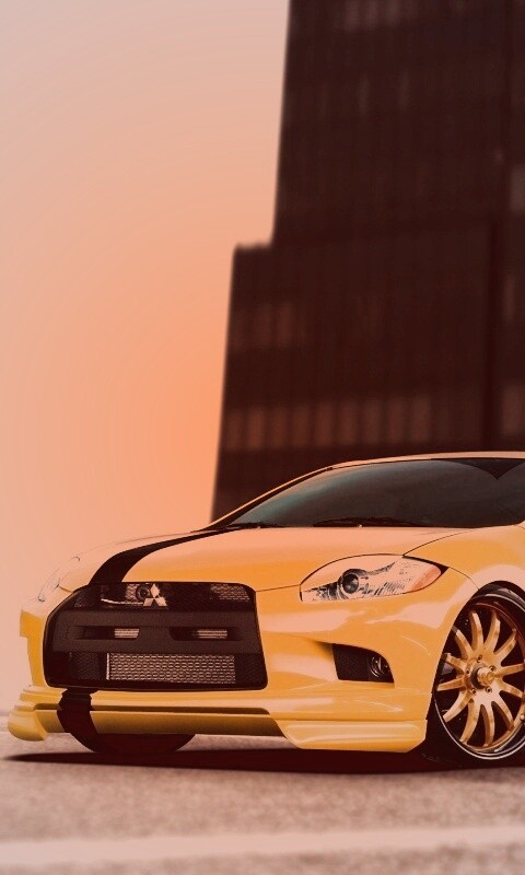 Mitsubishi жёлтого цвета с черными полосами обои