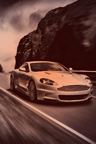 Астон мартин на горной дороге обои