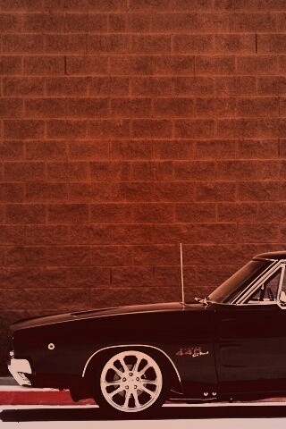 Черный Додж у стены обои