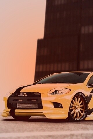 Mitsubishi жёлтого цвета с черными полосами обои