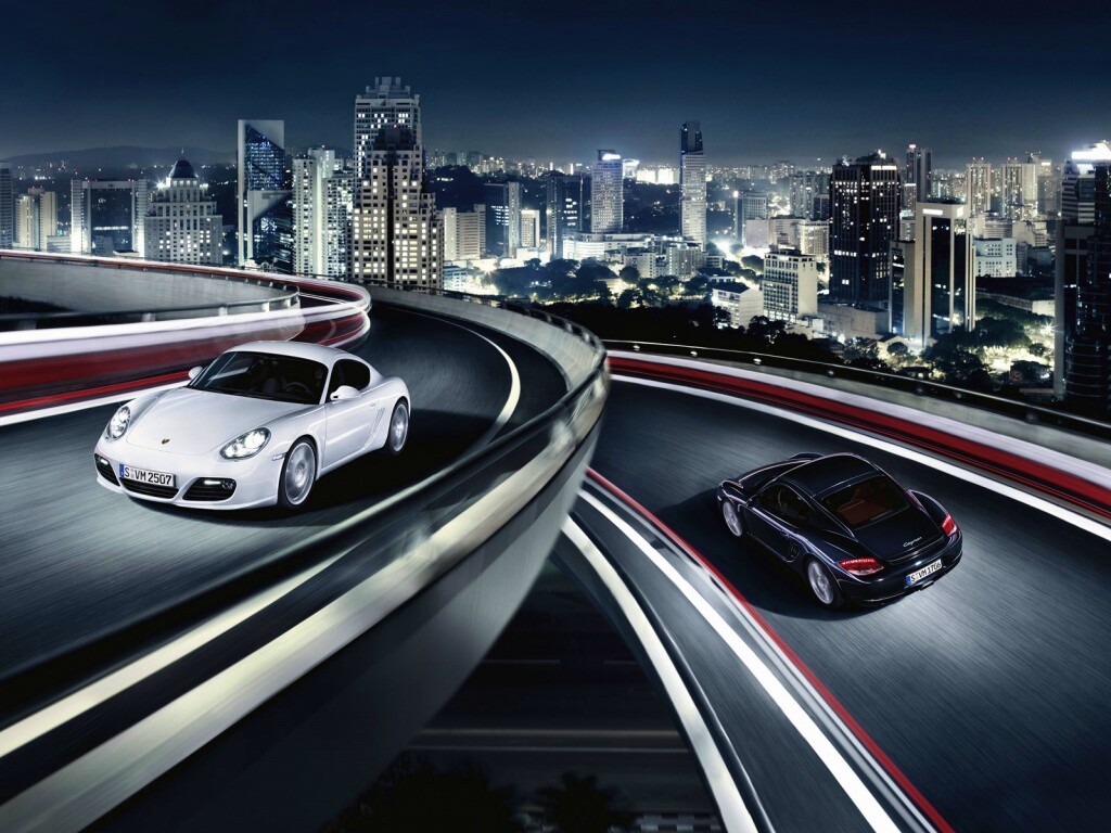 Черный и белый Porsche на автомагистрале. обои