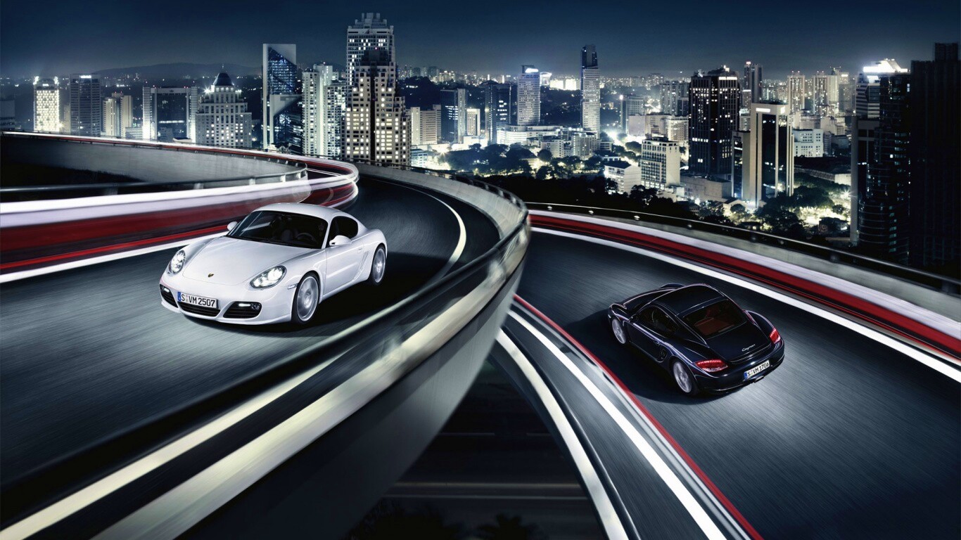 Черный и белый Porsche на автомагистрале. обои