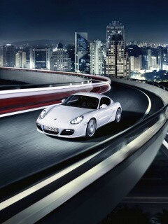 Черный и белый Porsche на автомагистрале. обои