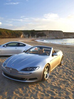 Два спорткара на берегу моря обои