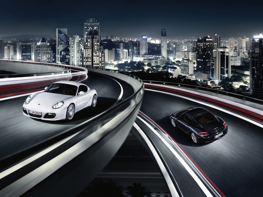 Черный и белый Porsche на автомагистрале. обои