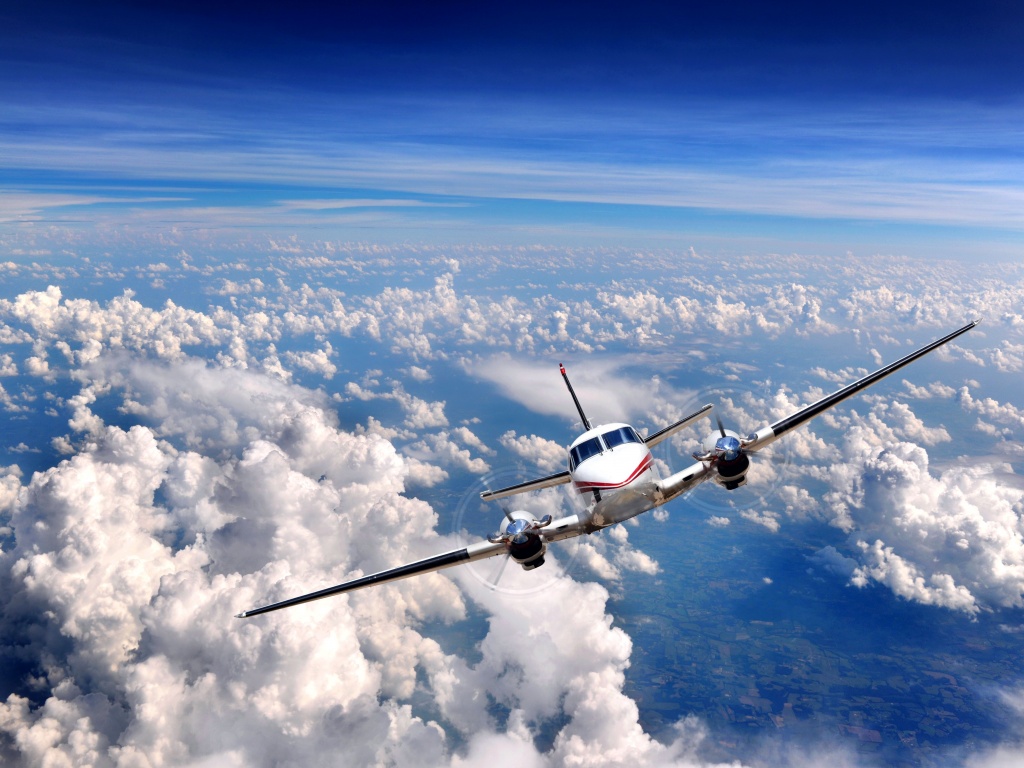Самолет над облаками обои