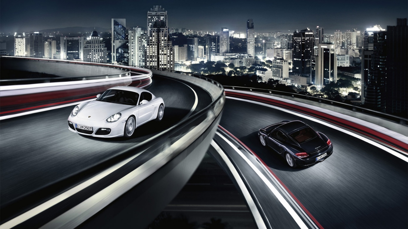 Черный и белый Porsche на автомагистрале. обои