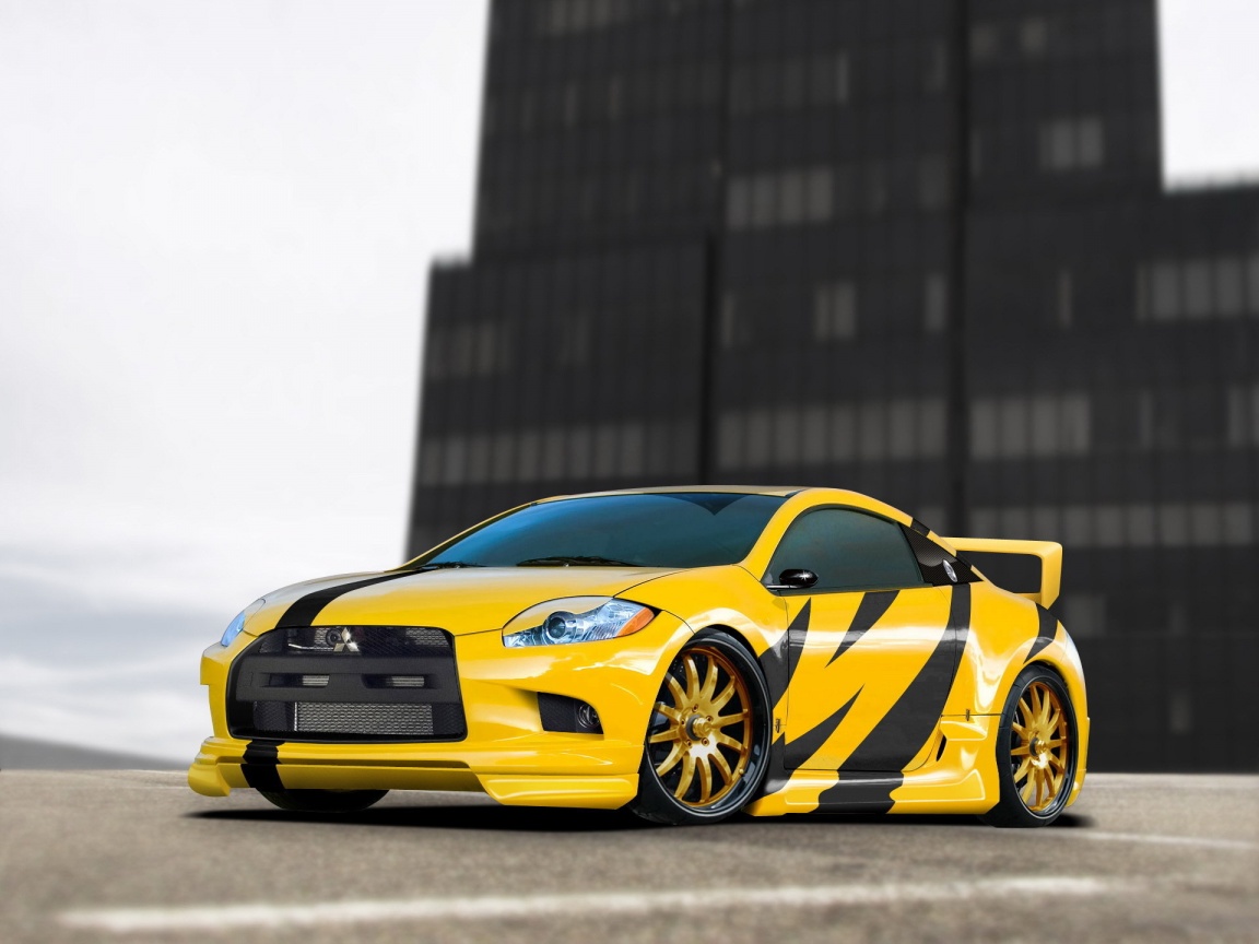 Mitsubishi жёлтого цвета с черными полосами обои