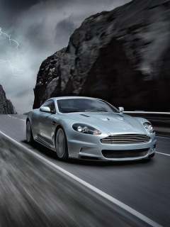 Астон мартин на горной дороге обои