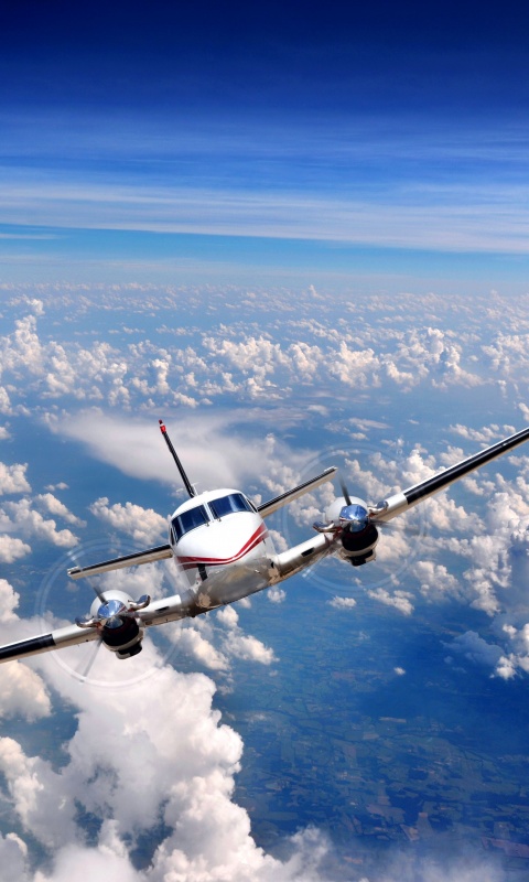 Самолет над облаками обои