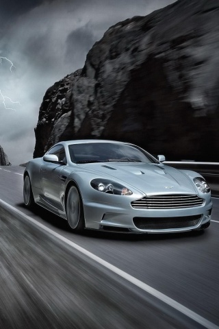Астон мартин на горной дороге обои
